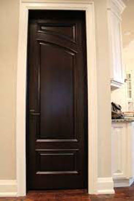 All-wood door with final layer of hardwood veneer